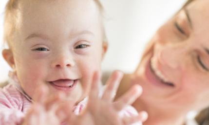 Mother and baby smiling