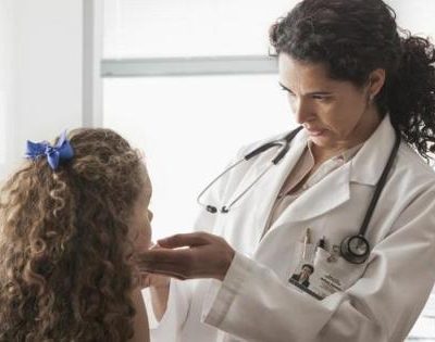 Doctor checking child