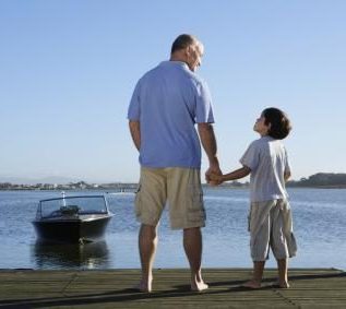 Father and son by the water