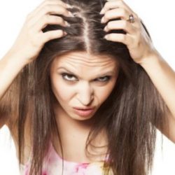 Woman checking hair