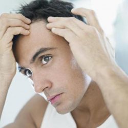 Man checking hair line