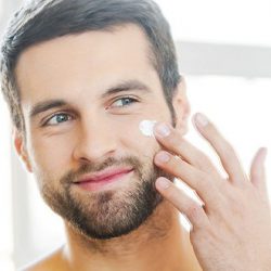 Man Applying Facial Cream