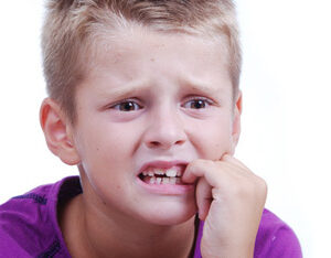 Stress expression on little blond kid's face Stress expression on little blond kid's face